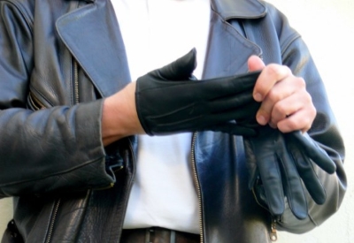 A Person Pulling a Black Color Gloves From Hand